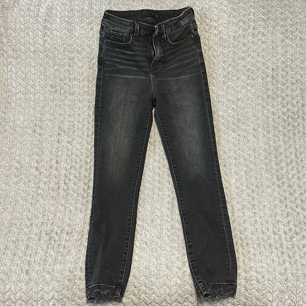 Buckle black skinny jeans